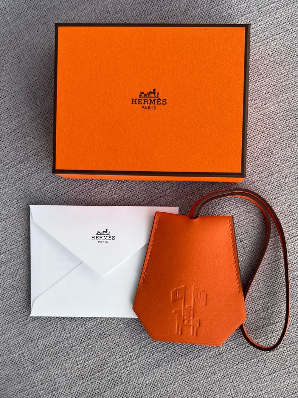 New Hermès Orange Leather Clochette Bag Charm